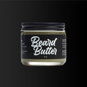 Close up image of bottom lit jar of Beard Butter beard care.