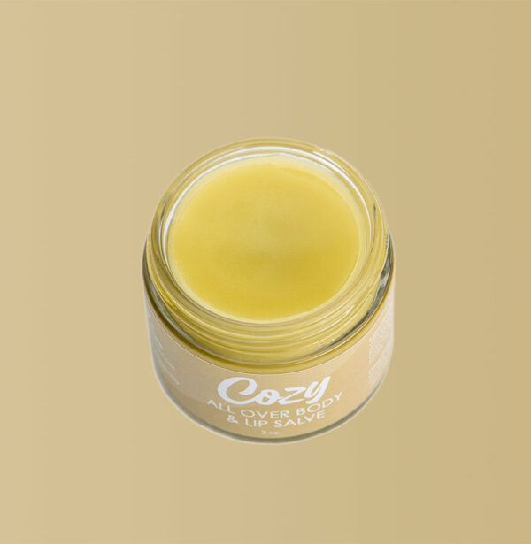 Open jar of Cozy All Over Body and Lip Salve.
