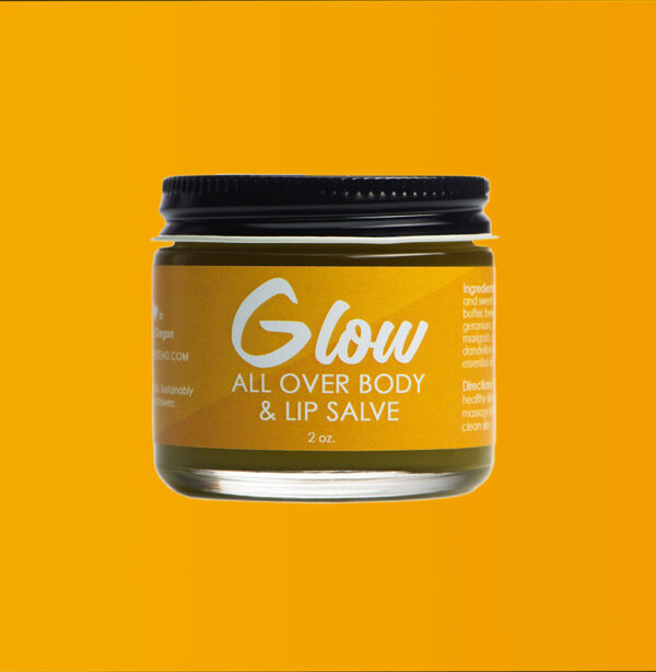 Close up photo of jar of Glow all over body and lip salve.